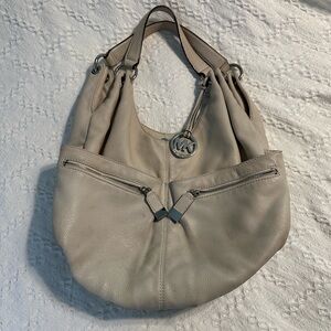 Michael Kors bag and cream.